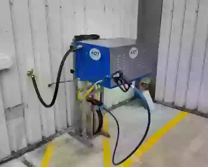 Nilfisk DTE cold static pressure washer mounted on a custom stainless steel frame with retractable hose reel for ambulance washing in Leicester. Nilfisk DTE pressure washer installed on a custom stainless frame with retractable reel for fast ambulance was